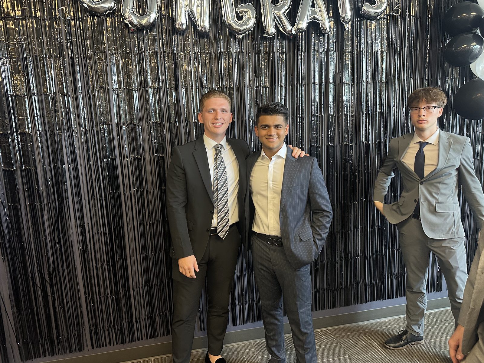 Two Alpha Marketing Concepts sales reps celebrating a career advancement milestone